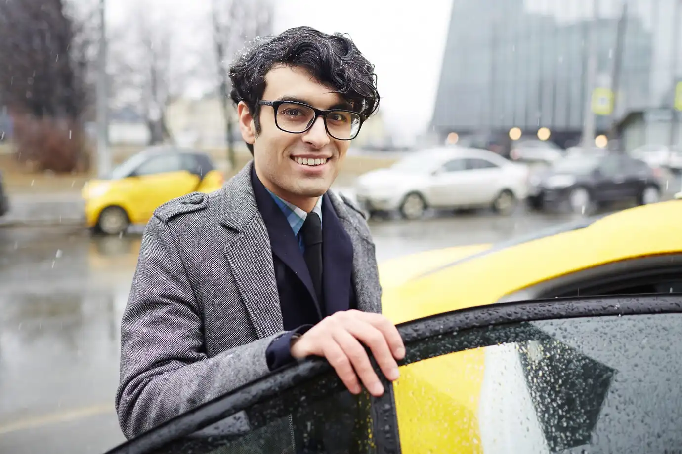 a young happy man after winning a case of lemon law cars